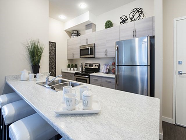 Summerhill Place in Nanaimo, BC Open-concept kitchen with breakfast bar and stainless steel appliances
