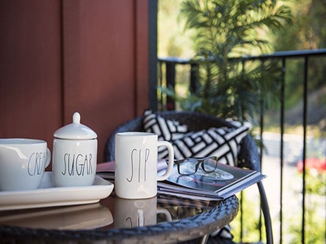 a table with coffee cups and plates on it