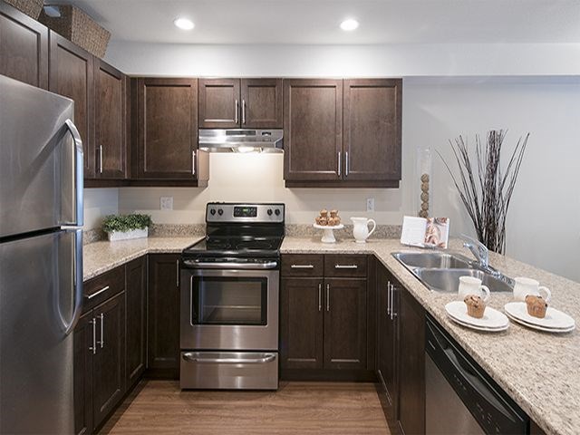 The Crest in Nanaimo, BC kitchen includes stainless steel appliances