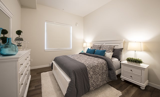 Summerhill Village apartments bedroom featuring luxury vinyl flooring in Nanaimo, BC