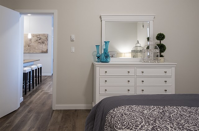 Summerhill Village apartments bedroom featuring luxury vinyl flooring in Nanaimo, BC