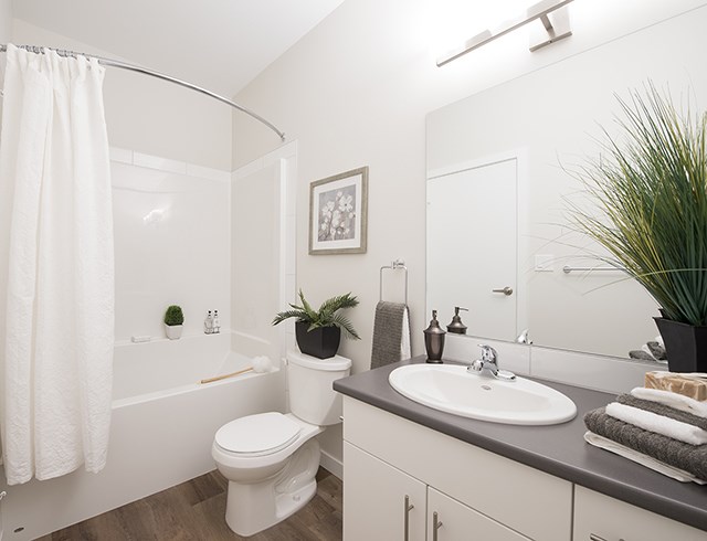 Summerhill Village apartments bathroom featuring tub shower in Nanaimo, BC