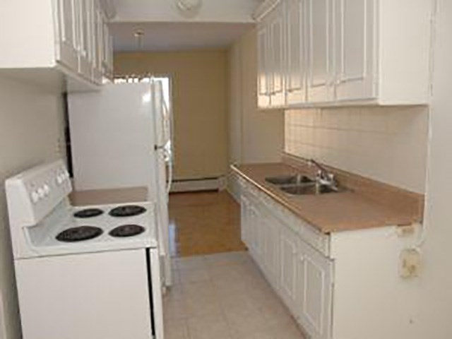 Mascot Place kitchen with full range stove in North York, ON