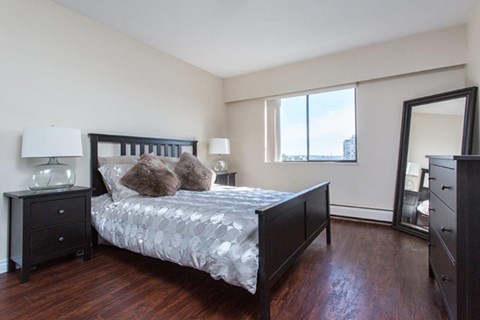 Citadel in North Vancouver, BC Bedroom with big mirror leaning against the corners of the wall