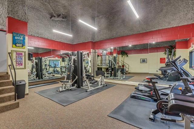 Shoreview in North Vancouver, BC Fully equipped fitness center with weight lifting machines and mirrors