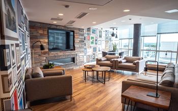 Social room  with a table and chairs and a tv at The Duke in Vancouver, BC