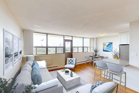 A living room with a grey couch and a coffee table.