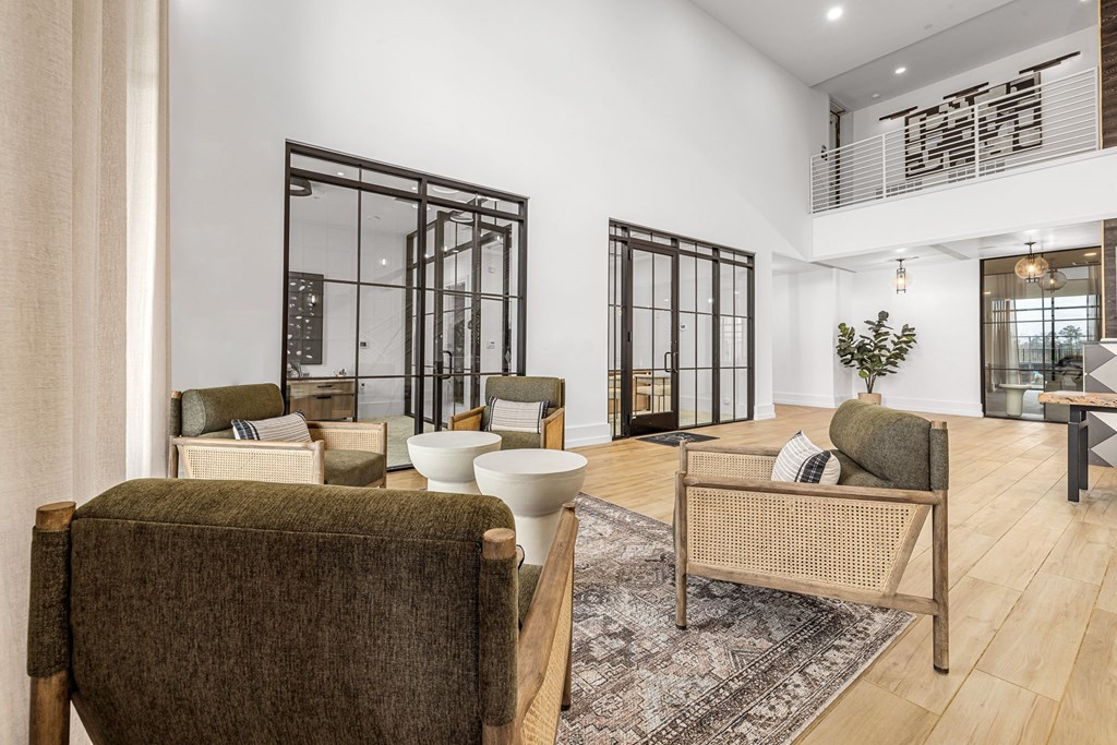 A living room with a brown chair and a white table.
