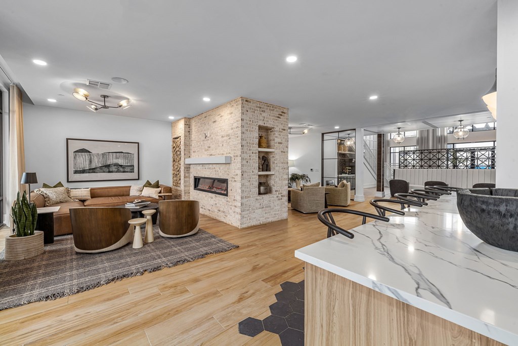 A modern living room with a fireplace and a dining area.