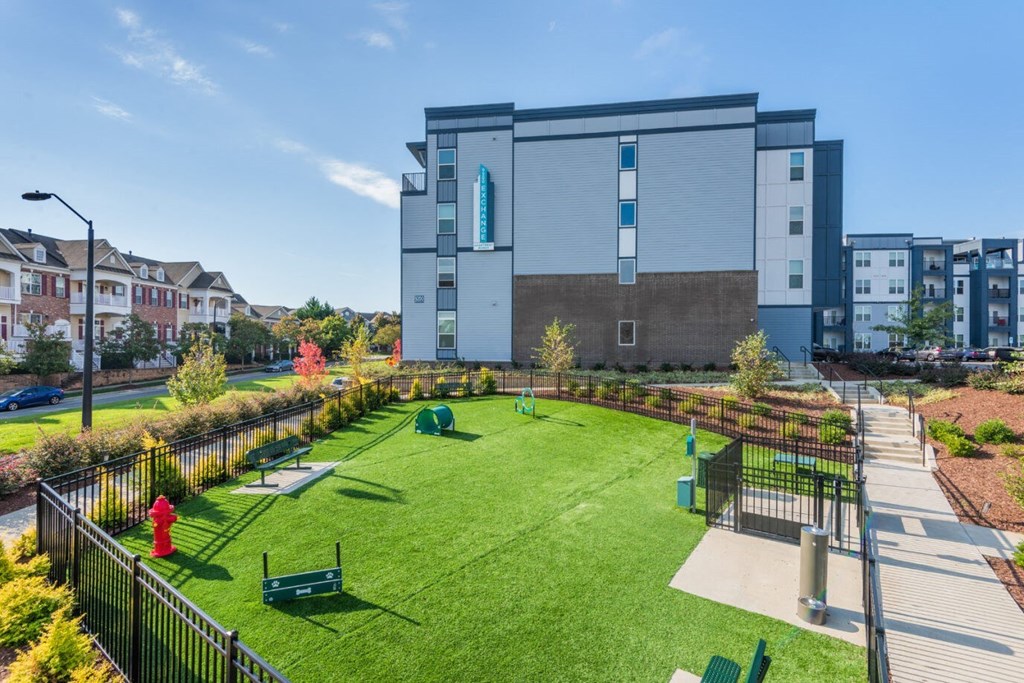 a large yard with a building in the background