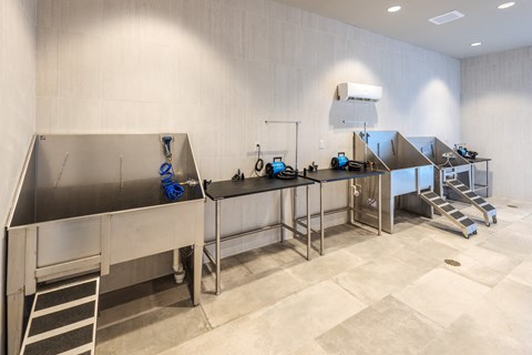 a large kitchen with stainless steel counter tops and sinks