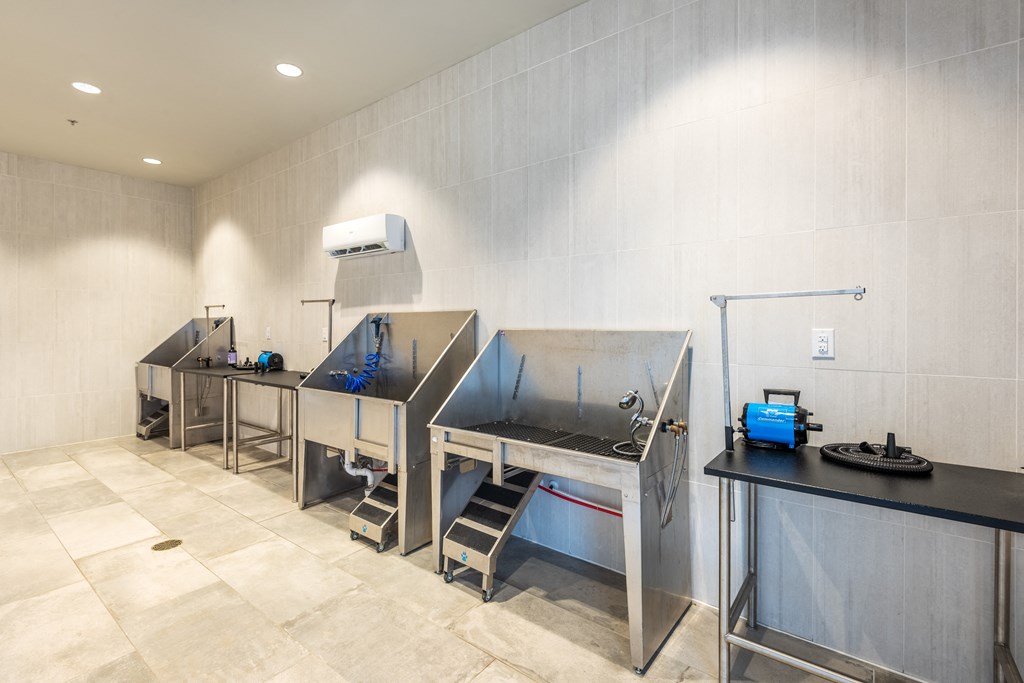 a kitchen with two stainless steel sinks and a counter top with a stove and a