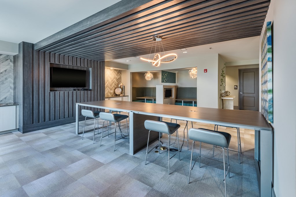 a conference room with a long table and chairs