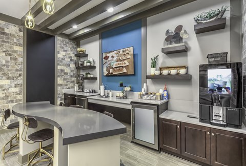 a kitchen with counter tops and a tv