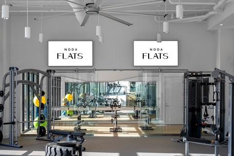 A gym with a sign that says NODA FLATS.