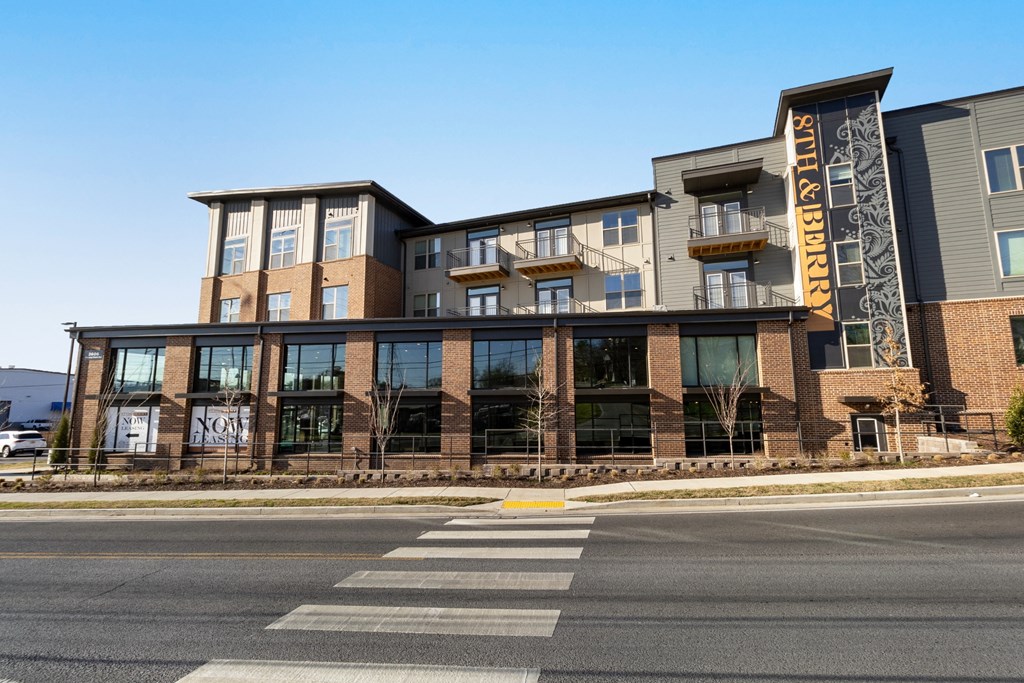 a building with a sign on the side of a street