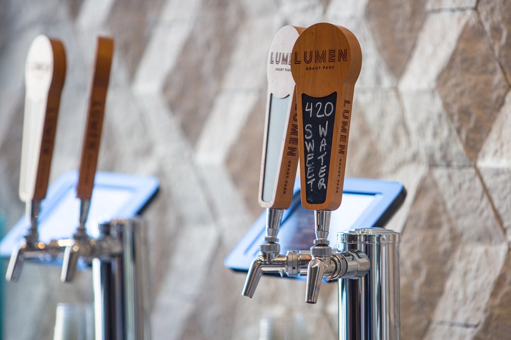 a set of wood and stainless steel gauges on a wall