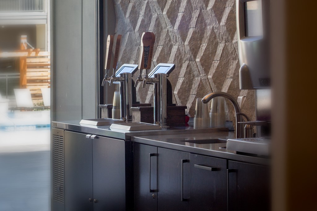 a kitchen with stainless steel appliances and a window