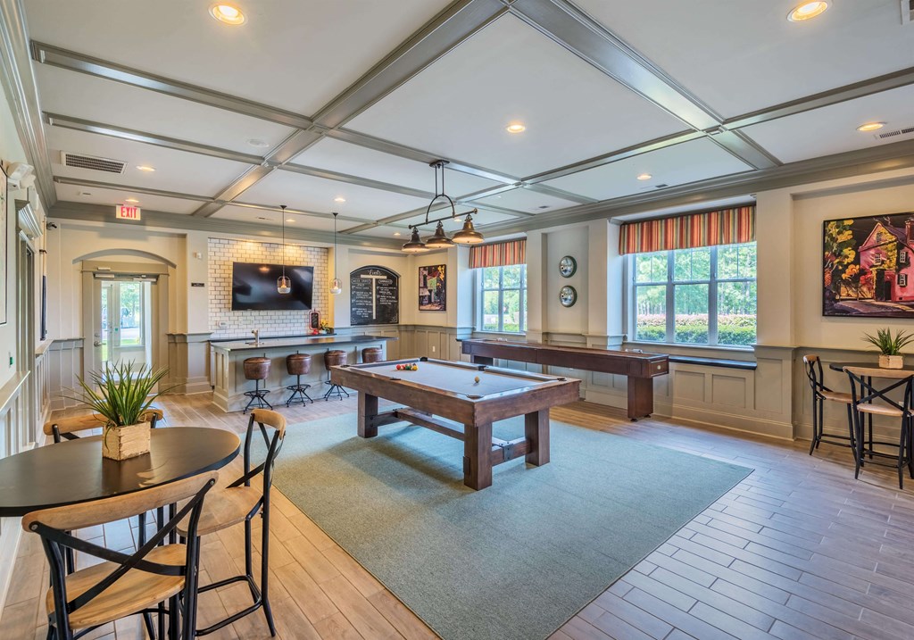 Clubhouse lounge game room with billiards and shuffleboard