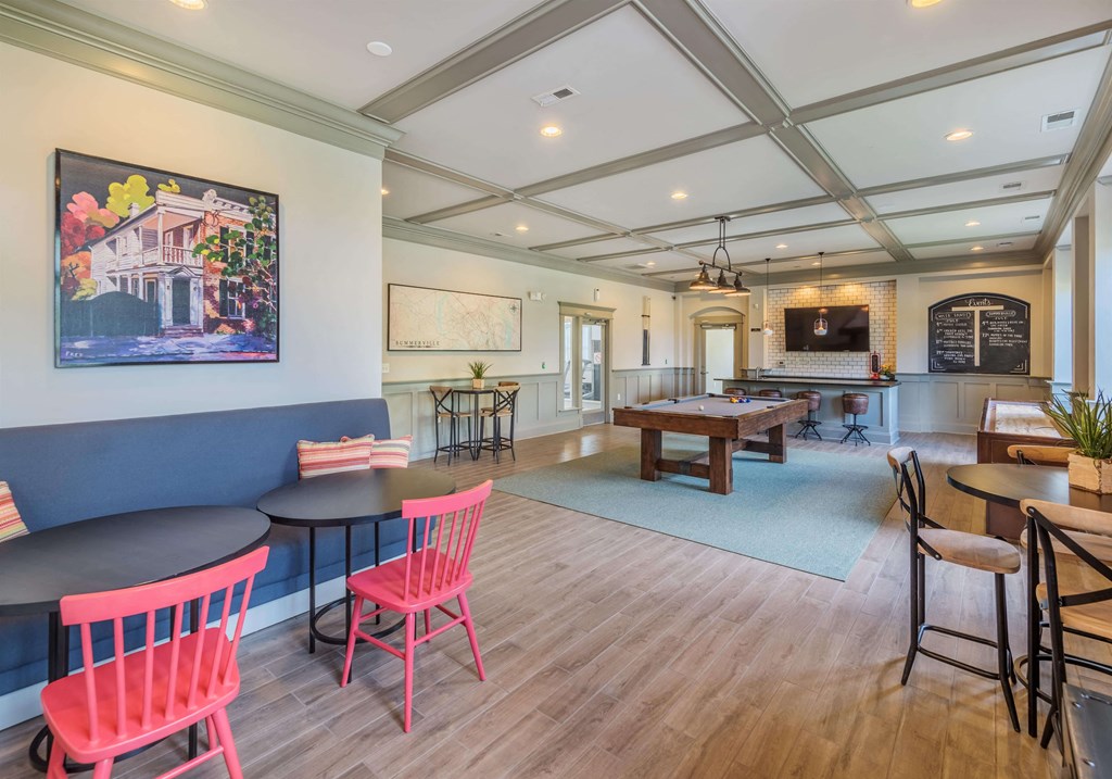 Clubhouse lounge game room with billiards and shuffleboard