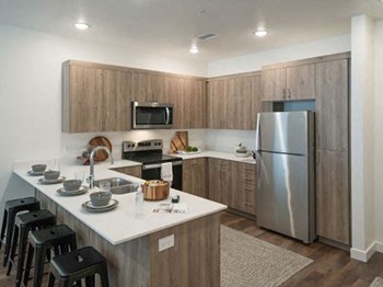 Well Equipped Eat-In Kitchen at Foothill Lofts Apartments & Townhomes, Logan, UT, 84341 - Photo Gallery 10
