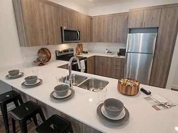 Quartz Countertop Kitchen at Foothill Lofts Apartments & Townhomes, Logan, UT, 84341 - Photo Gallery 11