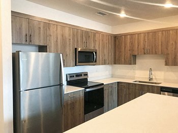 Fully Equipped Kitchen With Modern Appliances at Foothill Lofts Apartments & Townhomes, Logan, Utah - Photo Gallery 15