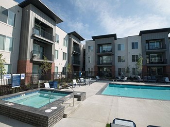 Hot Tub And Swimming Pool at Foothill Lofts Apartments & Townhomes, Logan, Utah - Photo Gallery 25