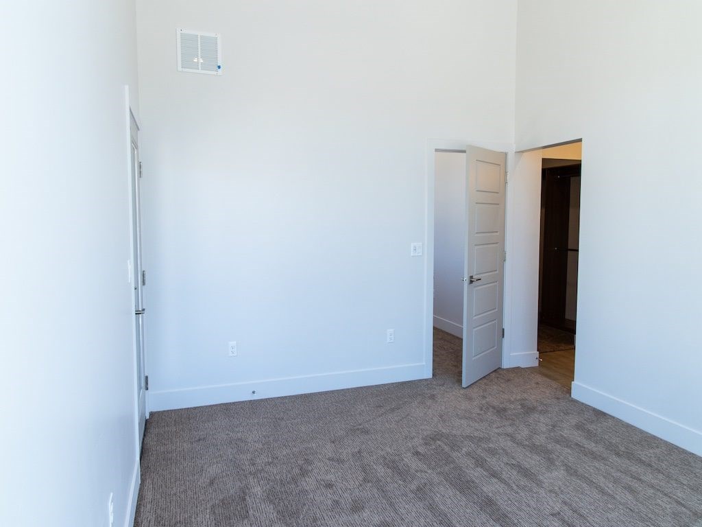 Empty Bedroom at The Ash Apartments & Townhomes