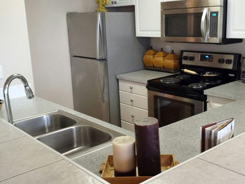 Burnett Station Townhome Kitchen Sink With Faucet at Metropolitan Collection Apartments, Renton, Washington