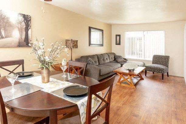 Living Room With Dining Area Living Room With Dining Area at California Place Apartments, California - Photo Gallery