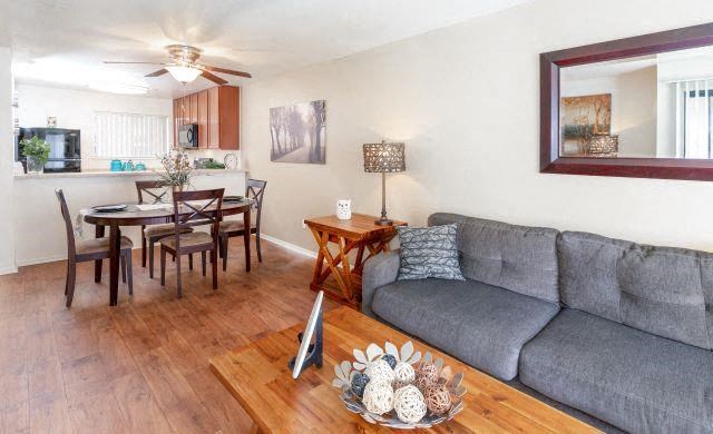 Living Room With Kitchen View at California Place Apartments, Sacramento
