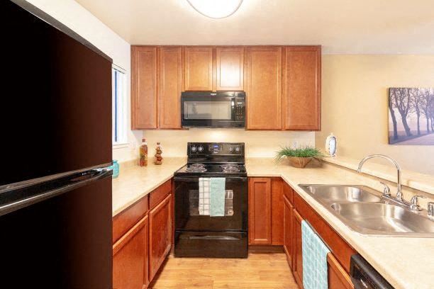 Modern Kitchen With Custom Cabinet Modern Kitchen With Custom Cabinet at California Place Apartments, Sacramento, 95823 - Photo Gallery