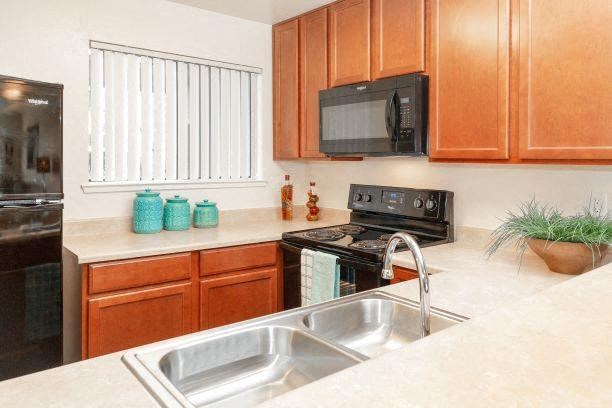 Sink With Faucet In Kitchen at California Place Apartments, California, 95823