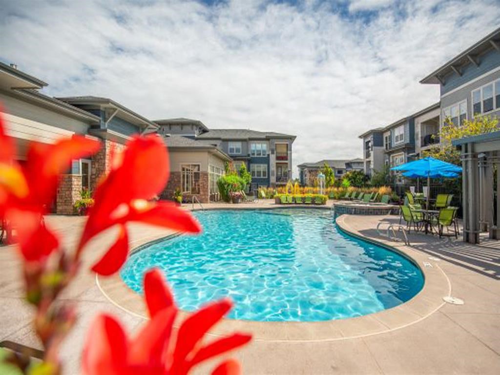 Crystal Clear Swimming Pool with Lounge Chairs at Avena Apartments, Thornton, CO, 80233