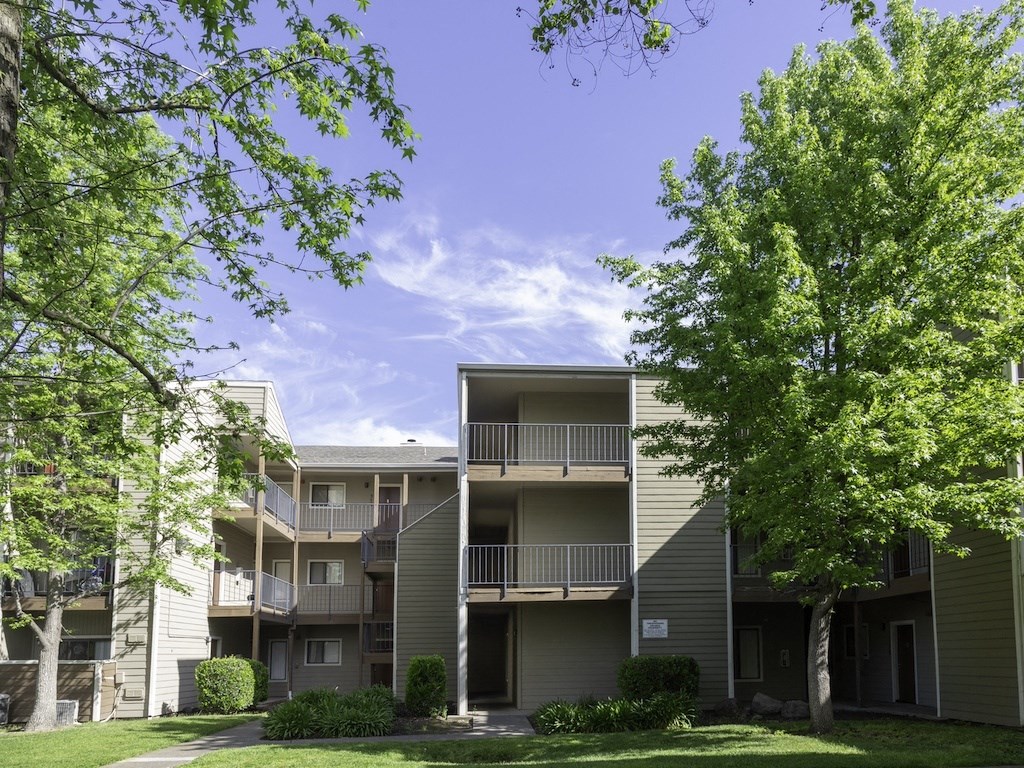 California Place Apartments by Trees