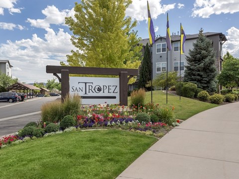 A sign that says San Tropez in front of a building.