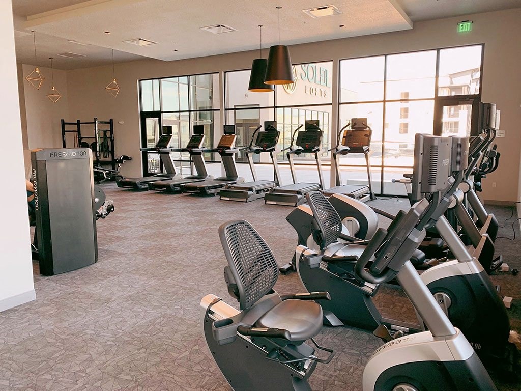 Fitness Center With Cardio Equipment at Soleil Lofts Apartments, Herriman, 84096