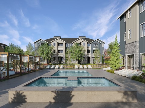A swimming pool in front of apartment buildings.
