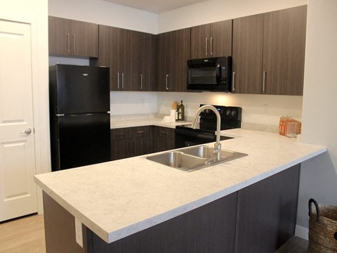 a kitchen with a counter top and a sink