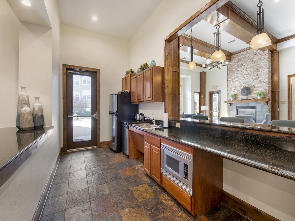 Kitchen in Clubhouse at Avena Apartments, CO