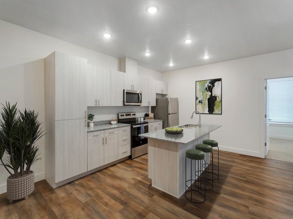 Kitchen with Island at Magnolia at Homestead staged