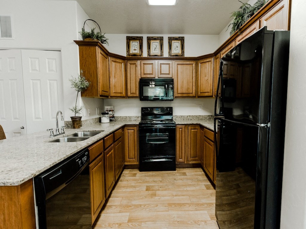 Kitchen with Modern Appliances at Falls at Riverwoods