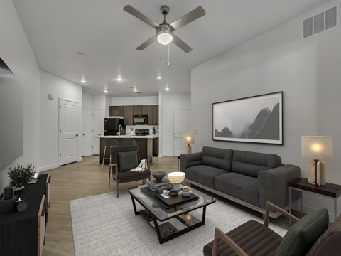 A modern living room with a grey sofa and a coffee table.