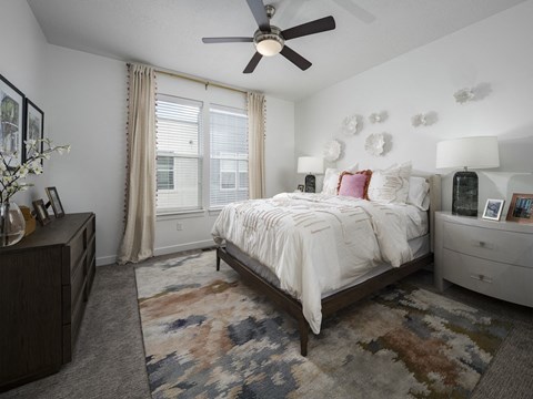 Primary Bedroom with a Ceiling Fan at Parc View Apartments and Townhomes Midvale, UT 84047