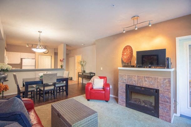 Living Room With Kitchen View at Metropolitan Place Apartments, Renton, 98057