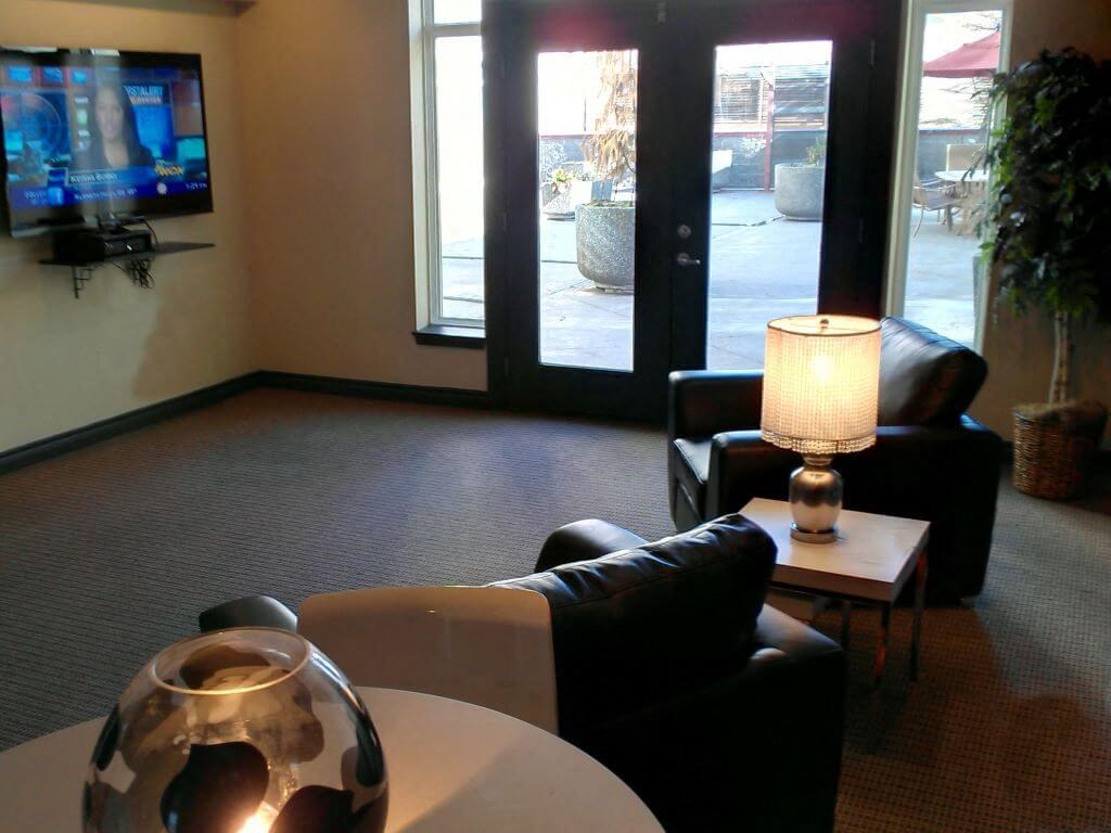 Community Room with TV at Metropolitan Collection Apartments, Renton, WA, 98057