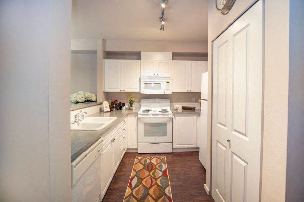 Kitchen With White Cabinetry And Appliances at Metropolitan Place Apartments, Renton, WA, 98057