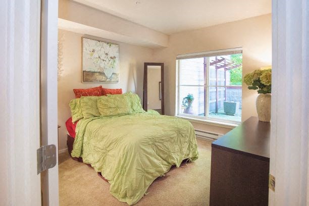 Primary Bedroom With Expansive Windows at Metropolitan Place Apartments, Renton, Washington