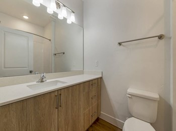 Guest Bathroom with Large Mirror and Vanity at Desert Sage Townhomes, Hurricane - Photo Gallery 10